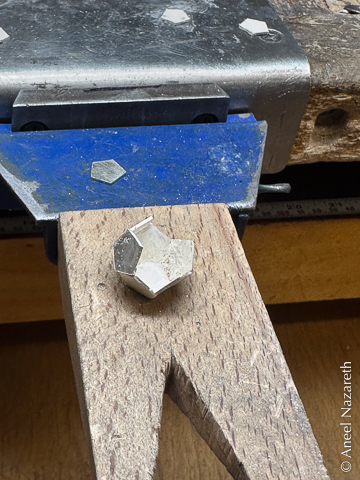 A partially assembled dodecahedron. Three faces remain to be placed.